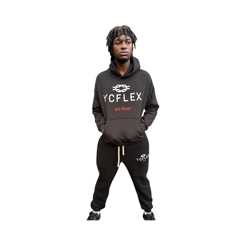 Person wearing a black hoodie with 'YCFLEX NO FEAR' text on a white background
